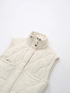 Quilted stand collar vest in cream white with adjustable drawstrings and large flap pockets