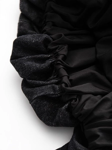 Black sleeveless denim dress featuring elegant balloon hem and mixed fabric textures