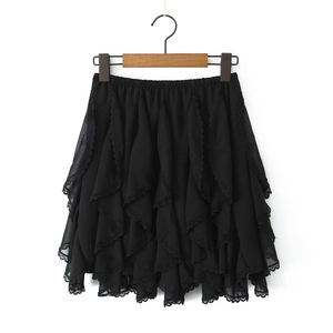 Close-up of black layered ruffle skirt with delicate lace trim and elastic waist detail