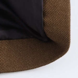 Detailed macro shot of brown twill canvas fabric and smooth navy blue lining on sleeve