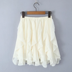 Detailed view of layered off-white lace skirt with ruffles and floral embroidery