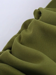 Olive green backless midi dress featuring elegant pleated fabric and slim-fit texture