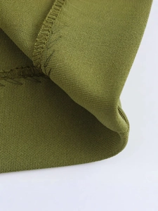 Olive green knitted backless dress with textured fabric and detailed double-stitch hem