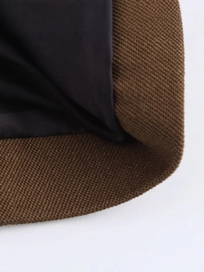 Women's dark brown woven blazer featuring a black inner lining and fine sewing details