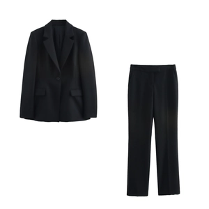 Detail of black notch lapel blazer and matching straight-leg pants with flap pockets