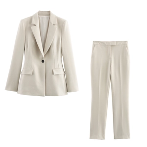 Flat lay view of a cream two-piece suit with notch lapel blazer and straight trousers