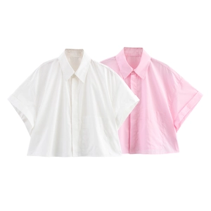 Detail of short sleeve cropped shirts showing turnover cuffs and a minimal chest pocket