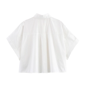 Detail view of the back inverted pleat on a white short-sleeved cotton blouse