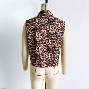 Detail view of the back of a vintage leopard print vest showing fabric texture and lapel