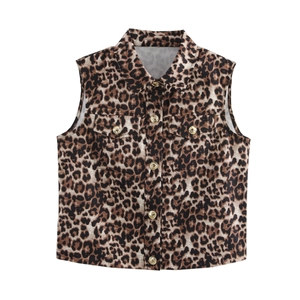 Detailed view of leopard print vest featuring gold metal buttons and chest flap pockets