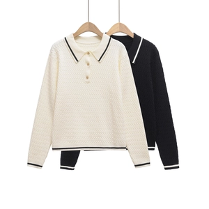 Close-up of contrast stripe polo collar and knit texture on long sleeve sweater