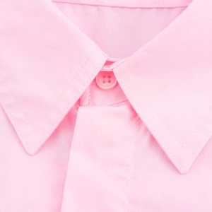 Detail of light pink casual short sleeve shirt showing pointed collar and neat stitching