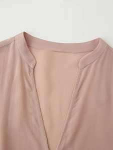 Chic mauve V-neck long sleeve blouse with tie detail and textured fabric in a loose fit