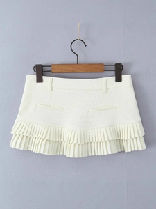 Chic ivory low-waist pleated mini skirt with belt loops and dual layer design