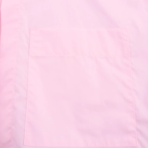 Close-up of a square pocket with refined stitching on a pink French-style casual shirt