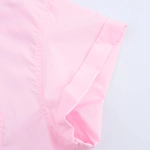 Detail of pink short sleeve shirt showing cuff hem and double-needle stitching