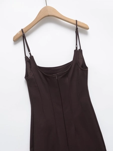 Close-up of adjustable straps and invisible back zipper on a brown slim dress