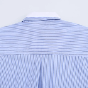 Detail of blue and white striped shirt featuring white collar and back box pleat design