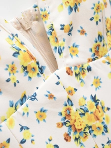 Macro shot of high-quality SBS zipper closure on floral print spring dress fabric