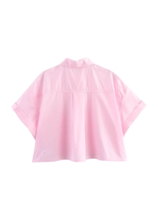 Back view of light pink boxy fit short sleeve shirt featuring an inverted pleat design