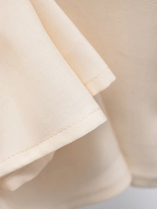 U-neck summer dress in apricot featuring fine knit texture and high-quality stitching details
