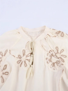 Women's cream boho blouse with floral embroidery, tassel V-neck and wooden beads