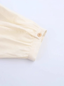 Cream long sleeve dress with floral embroidery and natural cotton-linen fabric texture