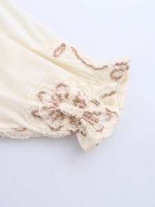 Off-white long sleeve shirt with floral lace embroidery and bohemian brown stitching