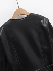 Detail of black PU leather jacket showing the round neckline and back stitching craftsmanship