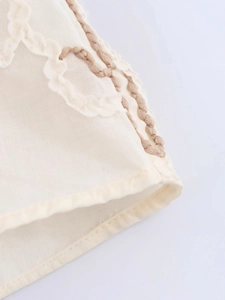 Women's ivory cotton-linen shirt with delicate brown flower embroidery and wavy scalloped edge