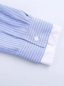 Women's blue and white striped long sleeve shirt with classic buttoned cuff detail