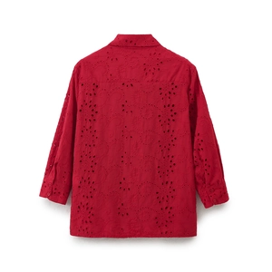 Detail view of the red cotton eyelet embroidery on the back of the long sleeve shirt