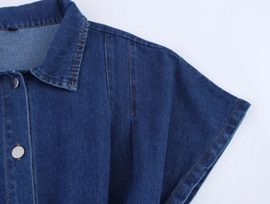 Close-up of classic dark blue denim dress collar with orange contrast stitching details