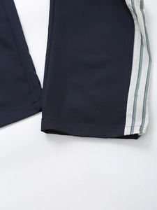 Navy blue straight-leg trousers with side striped tape and white hem detail