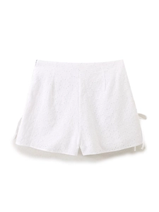 White eyelet embroidery shorts with high waist lace-up detail and floral cutouts