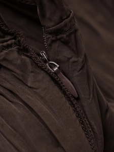Detailed macro view of high-quality invisible nylon zipper on deep brown textured fabric