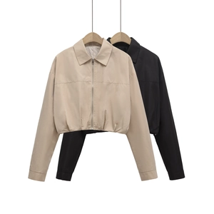 Detail of short cropped zip-up jackets with lapel collar in beige and black colors