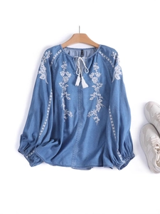 Women's vintage denim shirt with white floral embroidery and tassel drawstring v-neck