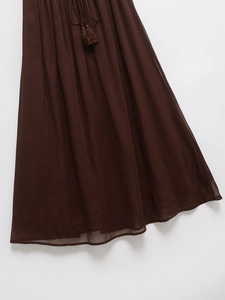 Brown pleated maxi skirt with elastic drawstring waist and tassel details in plain summer style