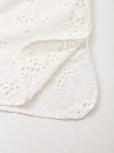 White embroidered shirt with delicate hollow patterns and side slits for women