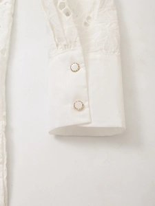 White eyelet embroidery shirt with elegant pearl button cuffs and lace details