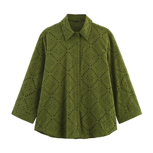Detail of olive green eyelet embroidery on long sleeve button-up shirt with collar