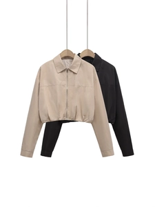 Short lapel zip-up jackets in beige and black displayed on hangers for casual summer style