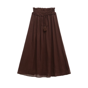 Brown high-waisted tiered A-line maxi skirt with elastic waistband and tassel drawstrings