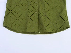 Detailed view of the olive green Broderie Anglaise shirt featuring intricate eyelet embroidery