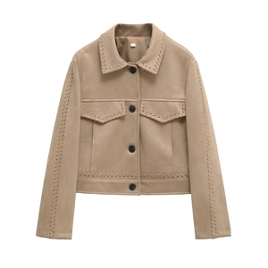 Detail of tan suede jacket featuring hand-stitched braided trim and black round buttons