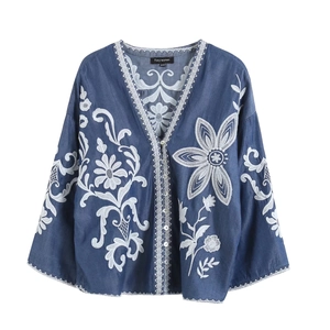 Vintage denim blue women's V-neck shirt featuring exquisite white floral embroidery