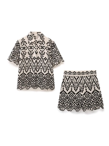 Women's summer two-piece outfit featuring embroidered short sleeve shirt and shorts set