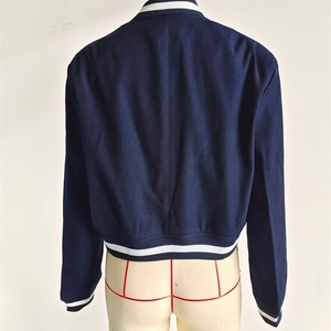 Slim fit navy blue Y2K utility jacket with white striped ribbing seen from the back
