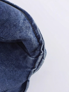 Deep blue denim vest for women featuring yellow contrast double stitching and V-neckline